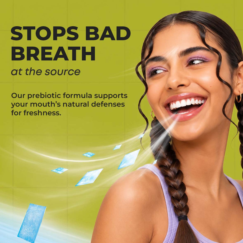 A smiling woman with dark hair and a purple tank top is shown against an green background with text reading 'STOPS BAD BREATH at the source' and descriptive copy about a prebiotic formula. Blue graphic bubbles illustrate fresh breath.
